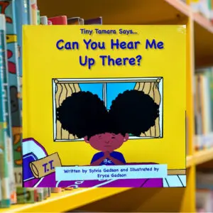 Children's book on a library shelf.